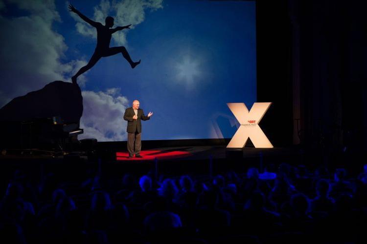 A speaker stands on stage during a previous TEDx event at Pacific.