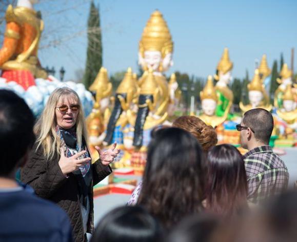 professor and students visiting Cambodian temple